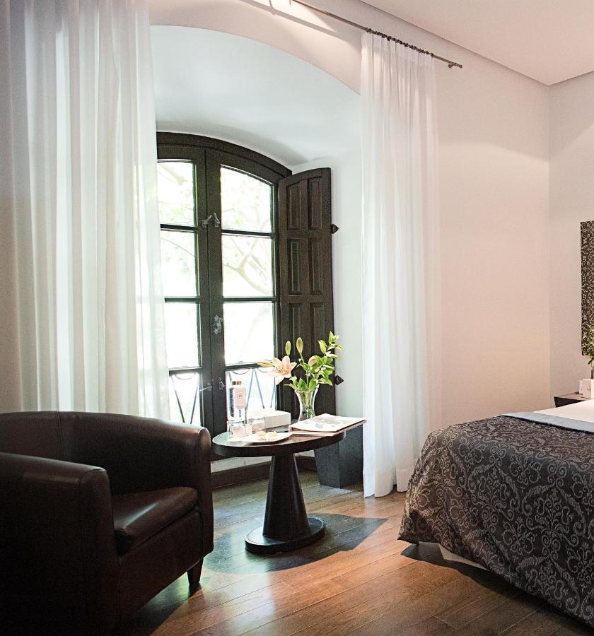 Hospes Palacio del Bailio Córdoba Exterior foto A room at Hotel 1728
