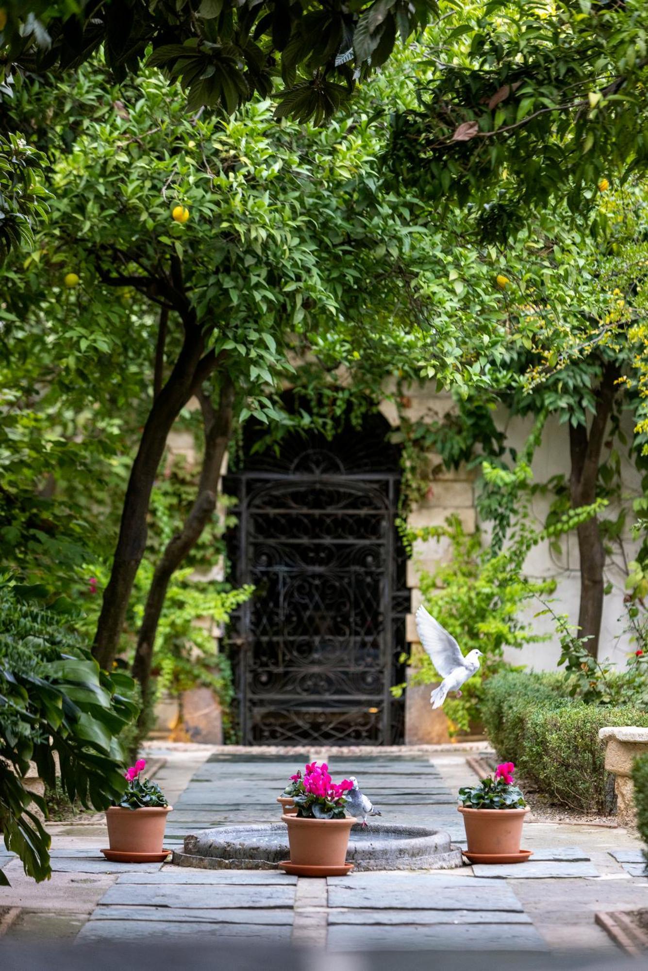 Hospes Palacio del Bailio Córdoba Exterior foto The gate of the house of the 10th Dalai Lama in Dharamshala
